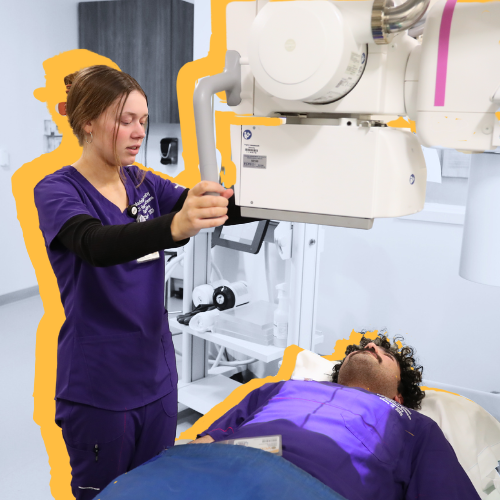 Radiation Sciences students practicing using an machine