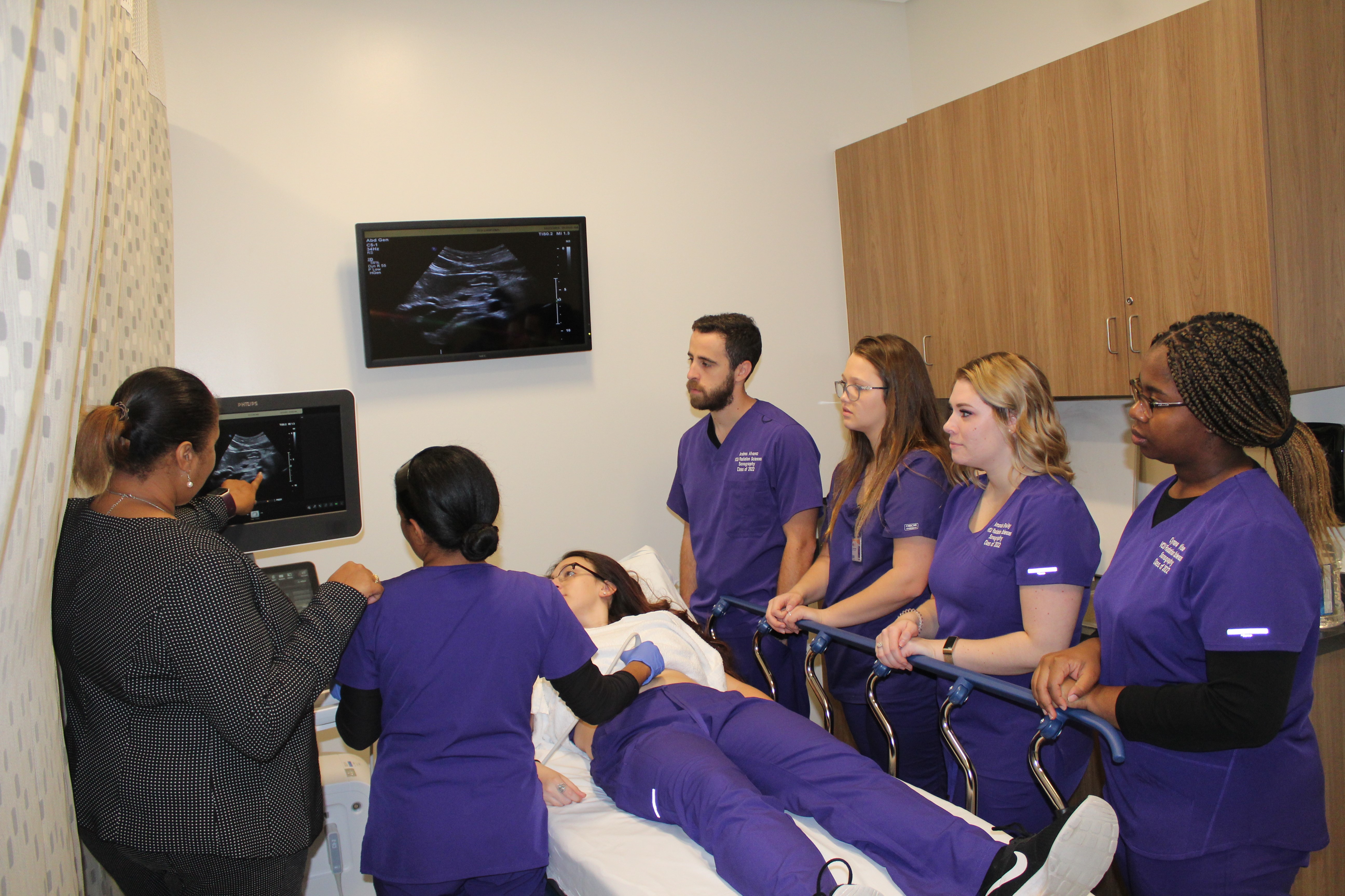 A group of students learn how to give an ultrasound