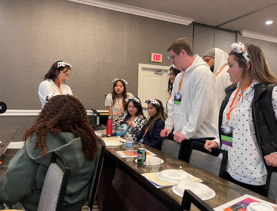 NMT students gather to see the contents of Julie Nguyen’s raffle gift.