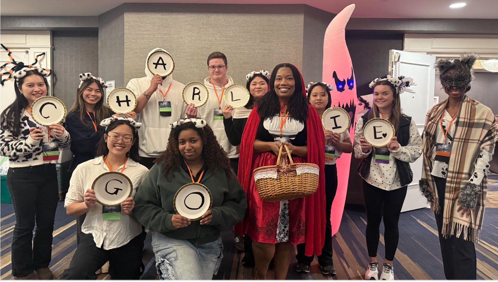 NMT students support Charlie Downing, holding signs that say Charlie Go!